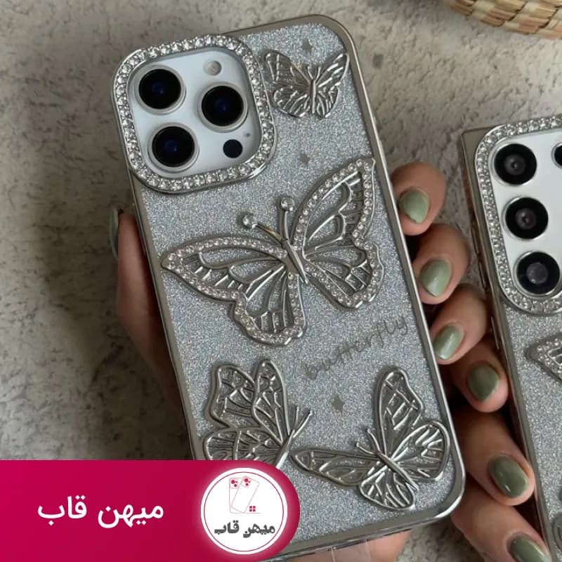 قاب موبایل آیفون – سامسونگ پروانه آموره نگین دار برجسته شاینی + بندست - کد (۱۰۴۷۲۸)